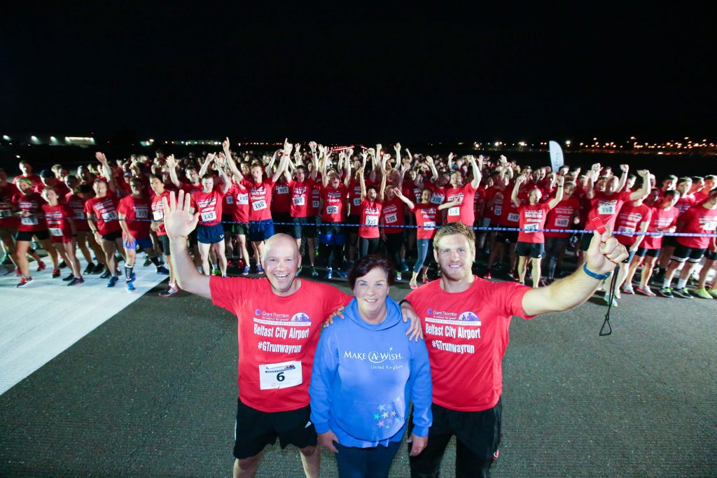 GRANT THORNTON RUNWAY RUN SCALES NEW HEIGHTS Richard Gillan, Managing Partner of Grant Thornton in Northern Ireland, Chris Henry, Ulster Rugby star and event ambassador, and Gail McKee of charity partner Make-A-Wish Foundation join runners at the starting line at last nightÕs Grant Thornton Runway Run at Belfast City Airport. The hugely-popular event attracted a record number of runners as 600 local businessmen and women took part in the 5k run on the tarmac of the airport. Teams of four from organisations across a wide range of sectors came together for the third year of the leading business advisory firmÕs event.