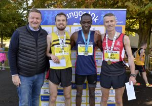 Stephen Patton, HR Manager of George Best Belfast City Airport with 2nd place winner of the Northern Ireland Ulster Championship Conan McCaughey, Winner of the Bangor 10K Gideon Kipsang and winner of the Northern Ireland Ulster Championship Declan Reed.