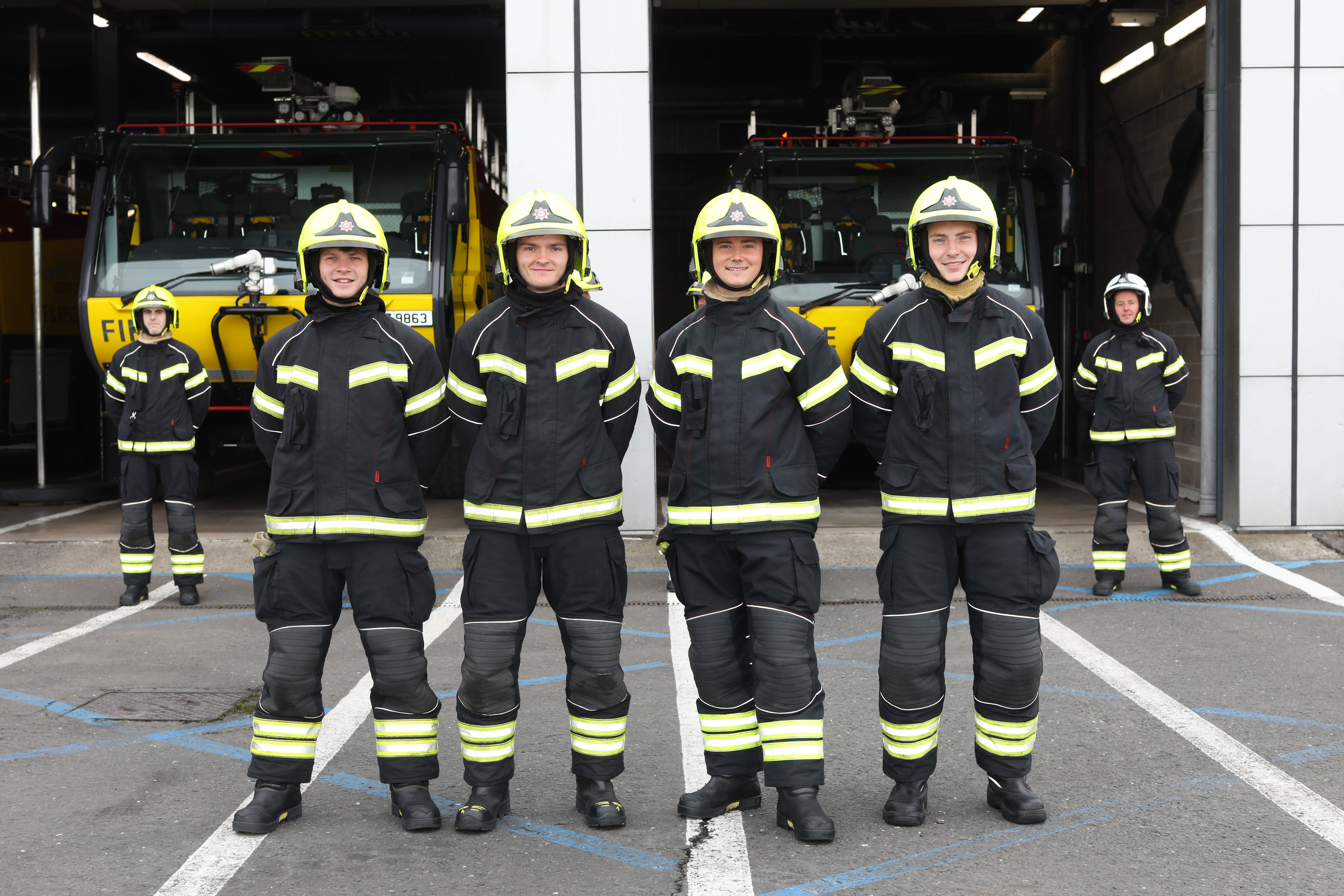 Four firefighting apprentices celebrate their graduation from Belfast City Airport's High Flyer's Apprenticeship Programme